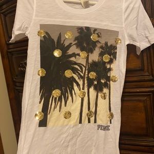 Just like new Victoria’s Secret pink XS t with embedded sequins. Palm trees
